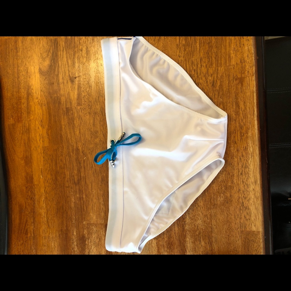 Men’s swim brief , pride pocket on back